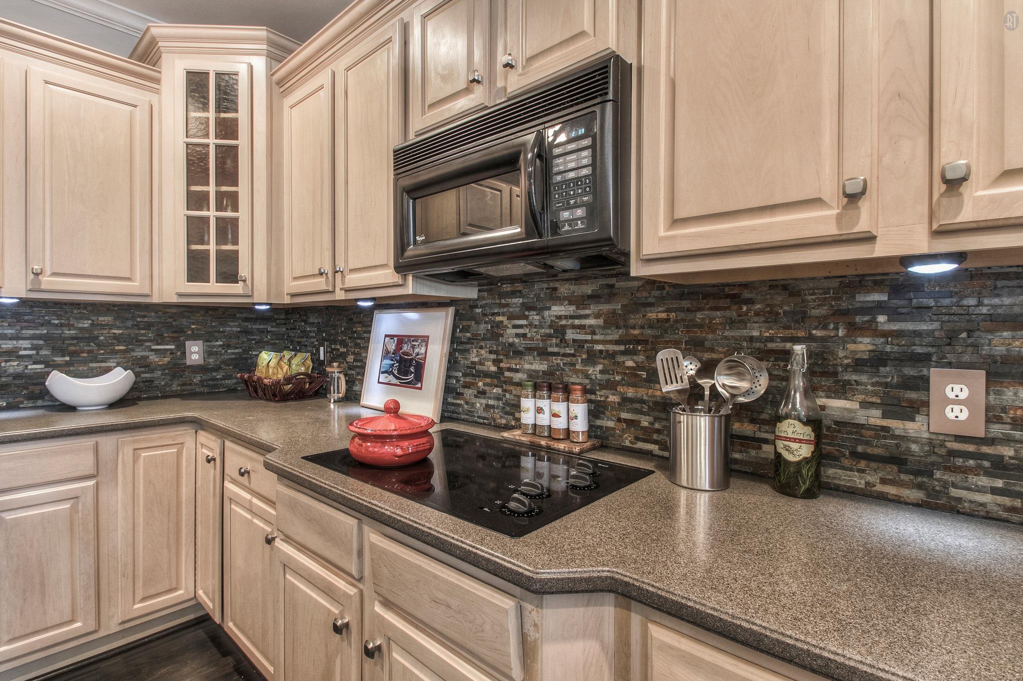 228 Halberton Drive Franklin, TN 37069 - Photo 11 of 23 a kitchen with stainless steel appliances granite countertop a sink a stove and cabinets