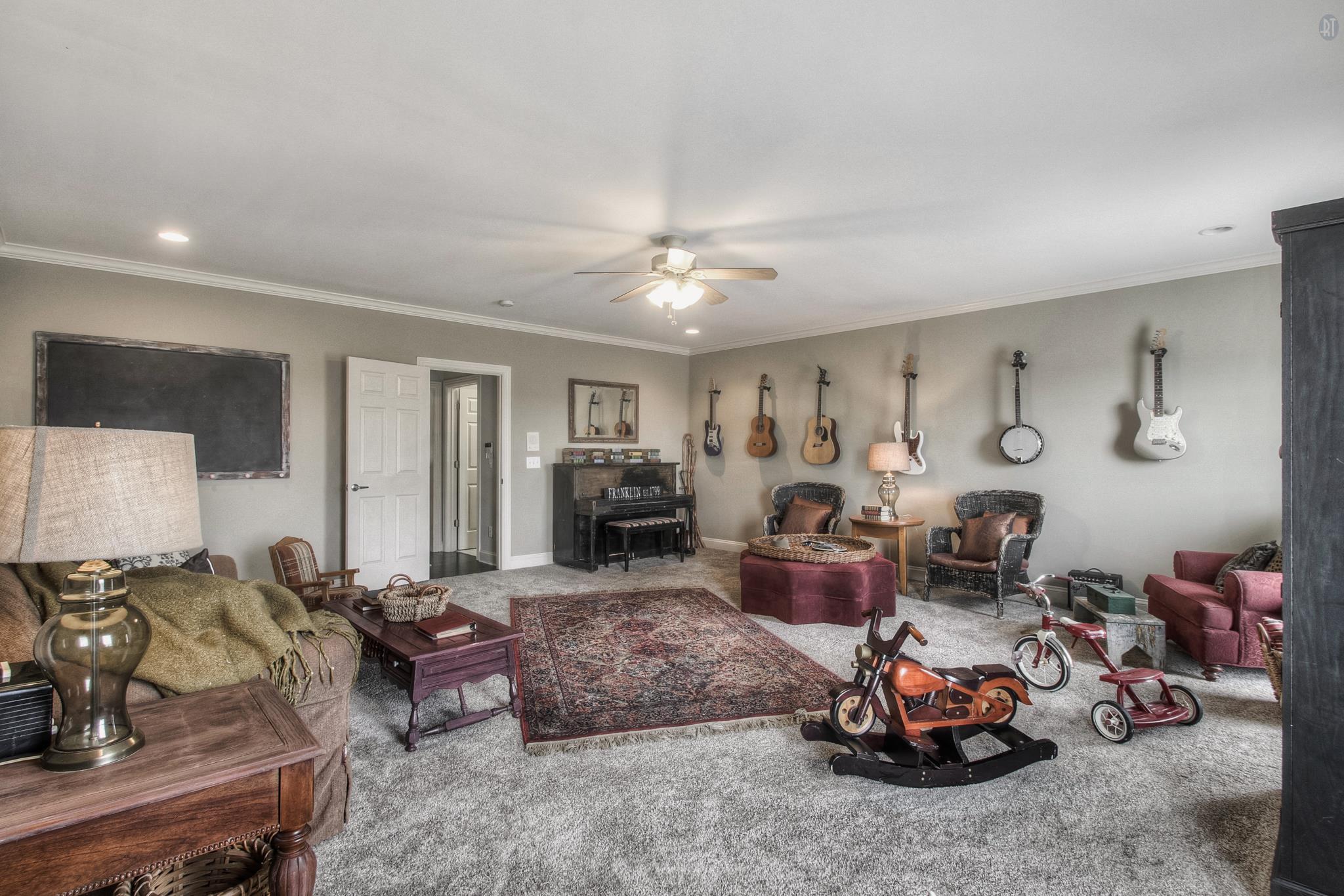 228 Halberton Drive Franklin, TN 37069 - Photo 13 of 23 a living room with furniture a window and a fireplace