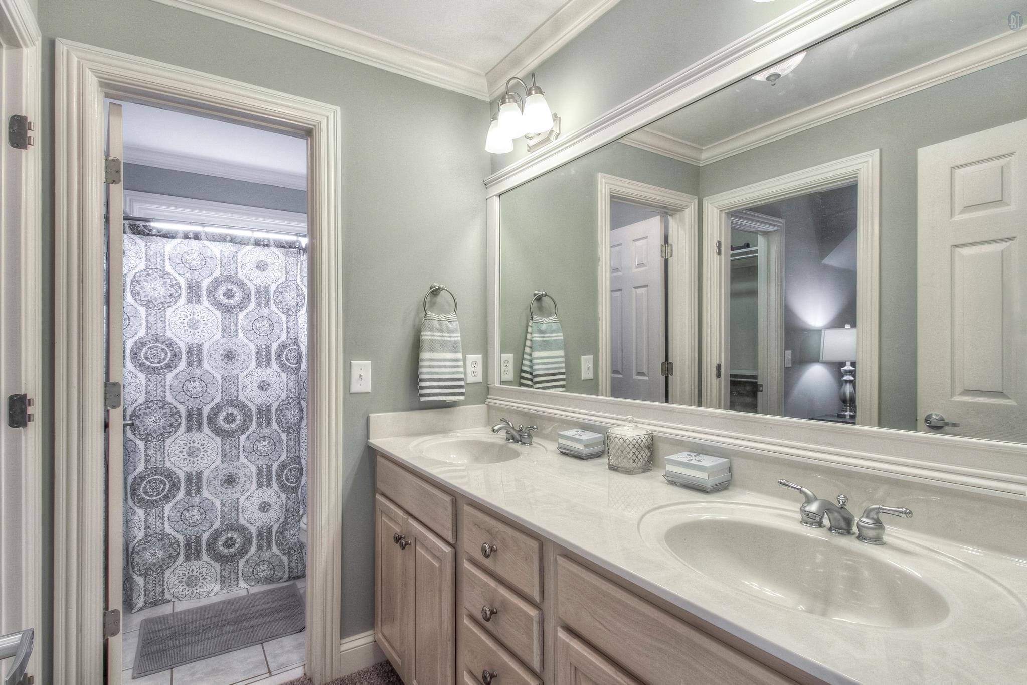 228 Halberton Drive Franklin, TN 37069 - Photo 15 of 23 a bathroom with a double vanity sink and a mirror