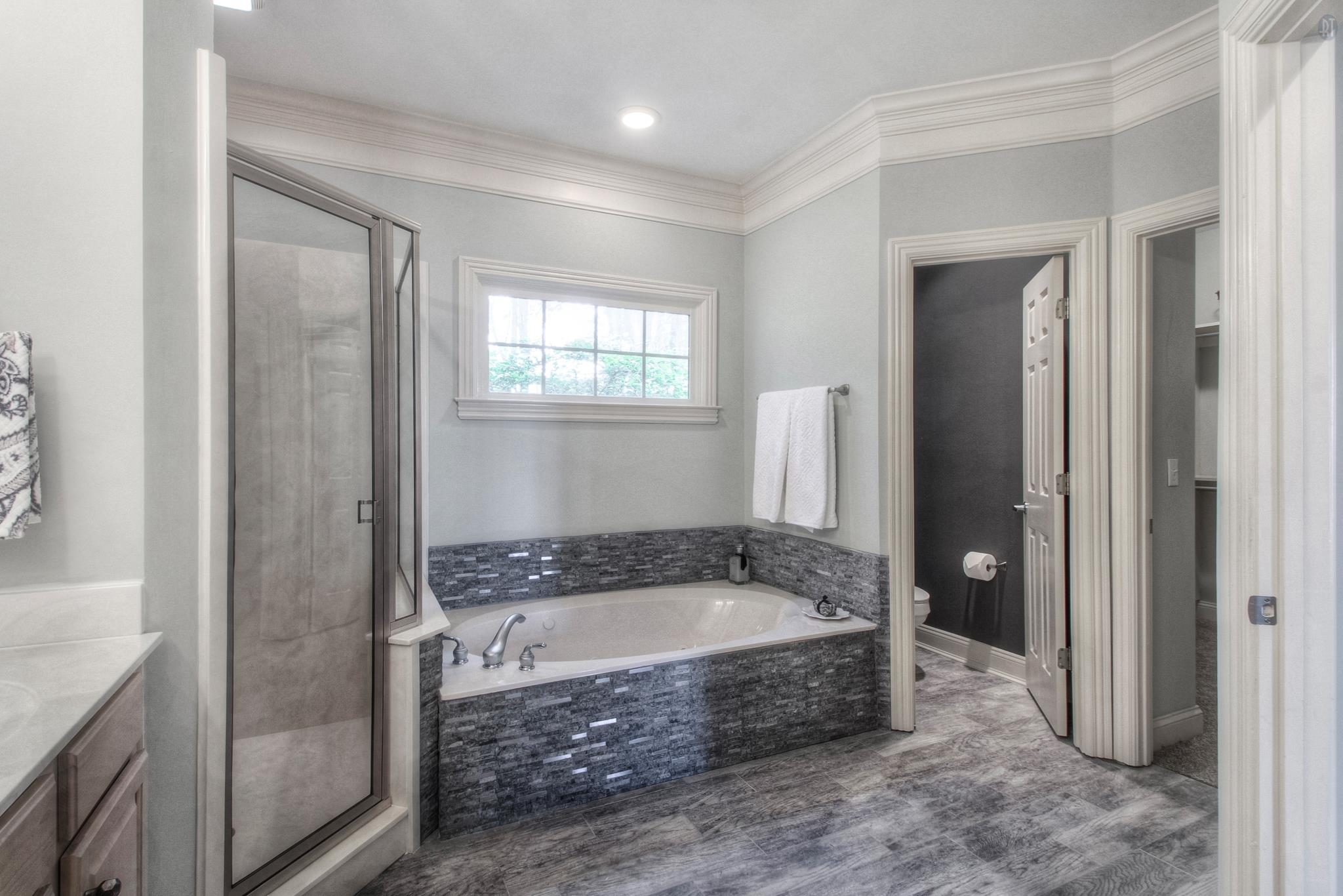 228 Halberton Drive Franklin, TN 37069 - Photo 7 of 23 a bathroom with a bathtub and a shower