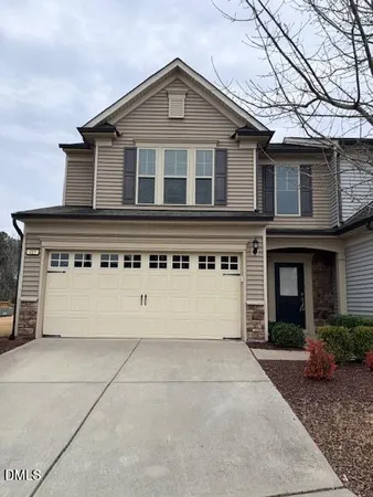 a front view of a house with a garage