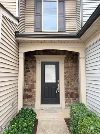 a front view of a house with a garage
