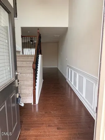 a view of entryway with wooden floor