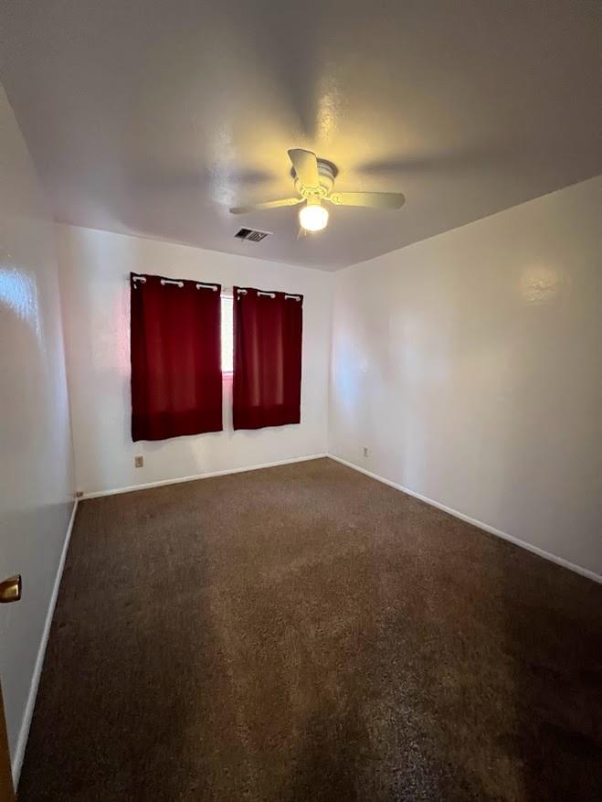 16109 East Manning Reedley, CA 93654 - Photo 22 of 30 an empty room with windows and fan