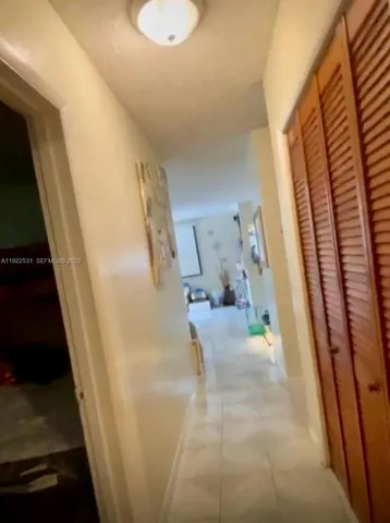 a view of entryway and kitchen