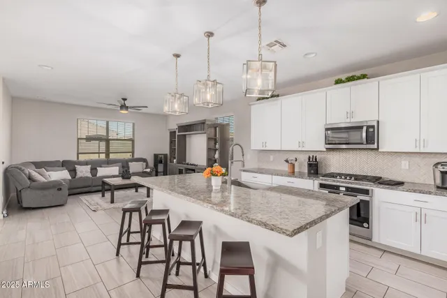 a bedroom with a bed and a night stand