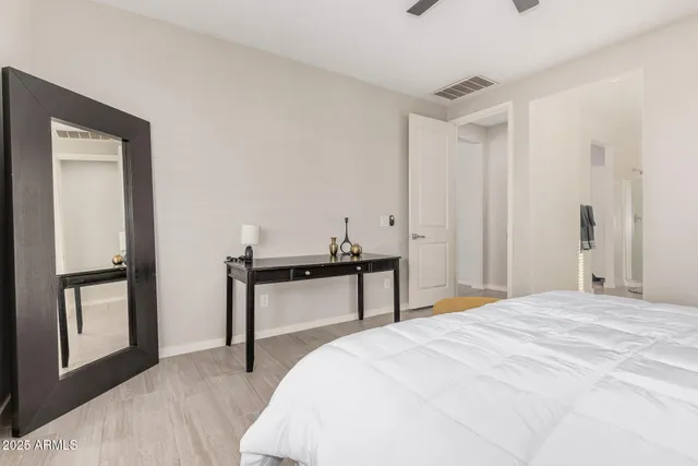 a bedroom with a bed and window