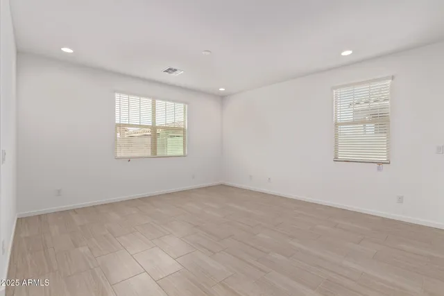a kitchen with stainless steel appliances granite countertop a sink stove and microwave