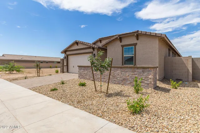 a view of a room with wooden floor and a window