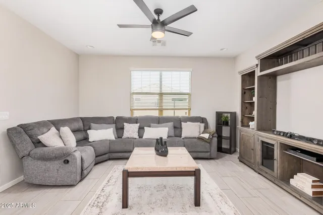 a large kitchen with stainless steel appliances granite countertop a sink a stove and a refrigerator