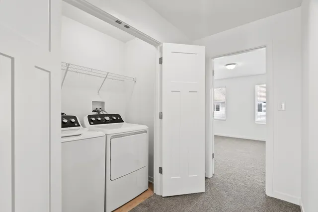 a view of a storage & utility room with washer and dryer