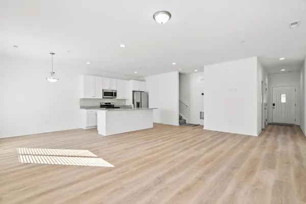 a view of kitchen with wooden floor