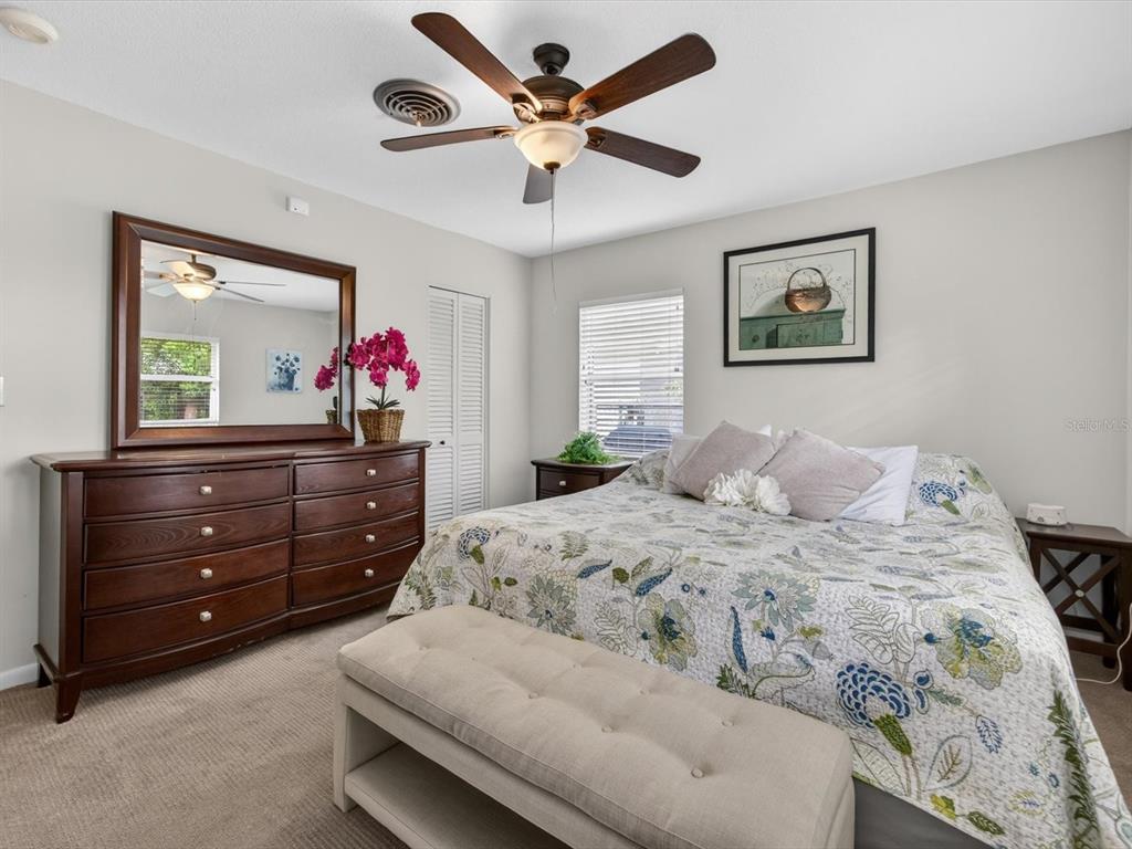 2803 Banchory Road Winter Park, FL 32792 - Photo 14 of 31 a bedroom with a bed and a dresser
