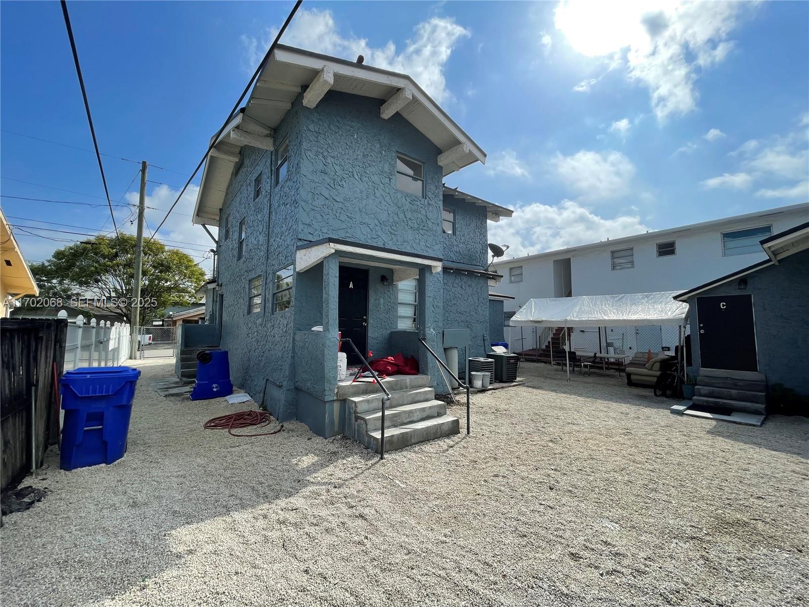 236 Southwest 10th Avenue Miami, FL 33130 - Photo 4 of 15 a view of the patio with chair and tables