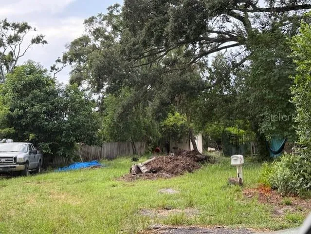 a backyard of a house with lots of green space