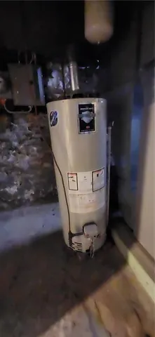 a view of a backyard with two chairs and a rug