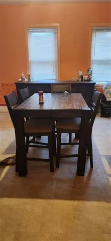 a living room with furniture a fireplace and a table