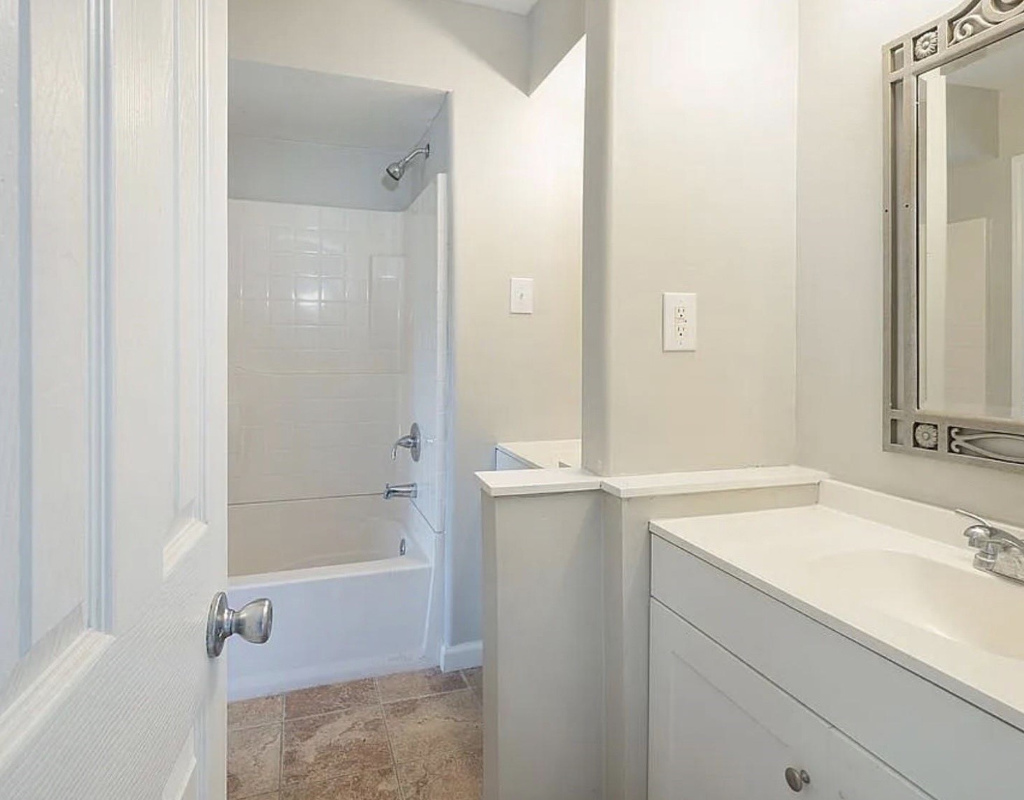 1965 Campbell Road, Unit 1965 Houston, TX 77080 - Photo 6 of 13 a bathroom with a sink and a mirror
