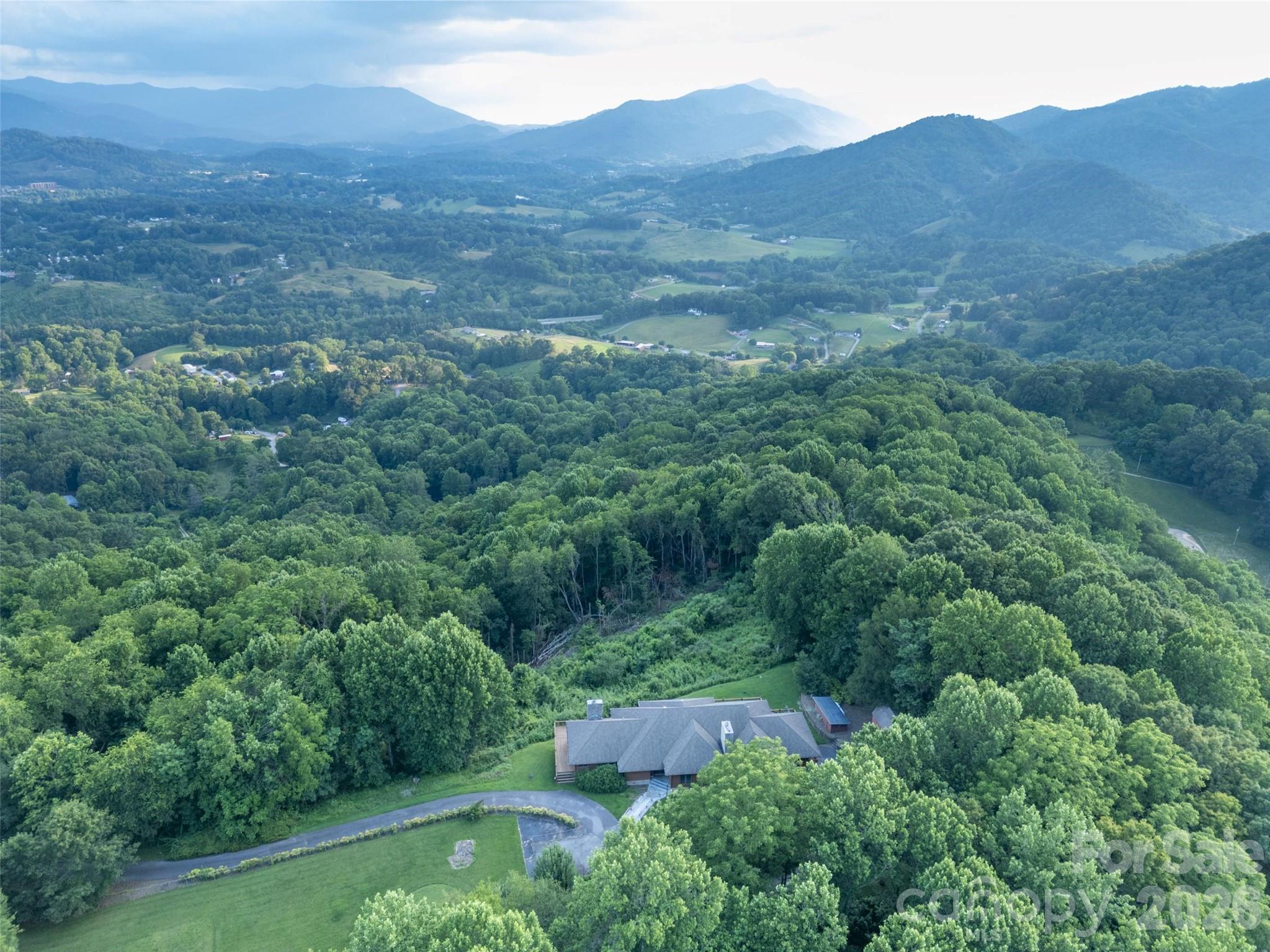 1087 Brigadoon Drive Clyde, NC 28721 - Photo 35 of 42 an aerial view of residential houses with outdoor space and trees
