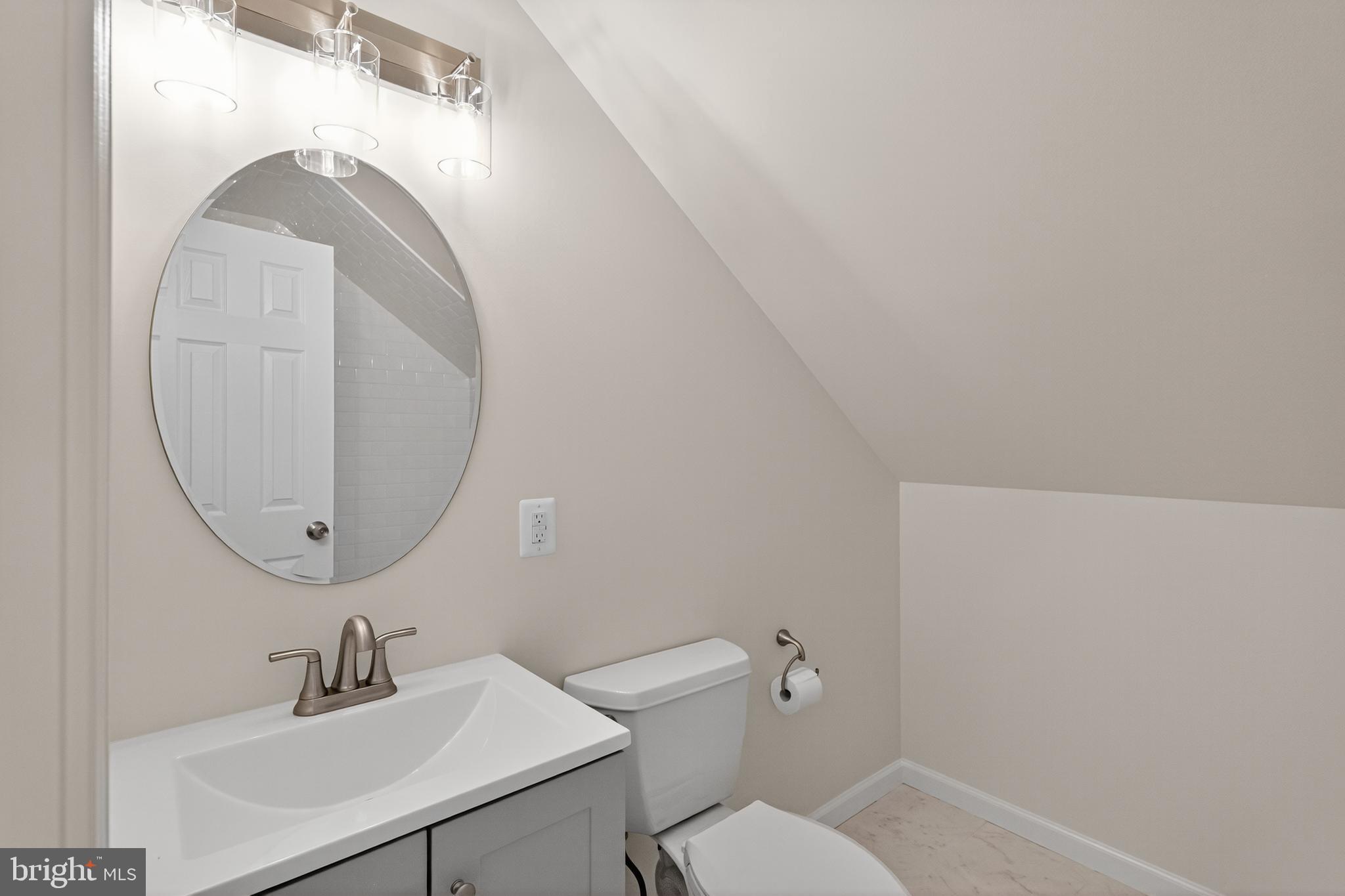 10612 Honeyfield Road Williamsport, MD 21795 - Photo 12 of 19 a bathroom with a sink mirror and toilet