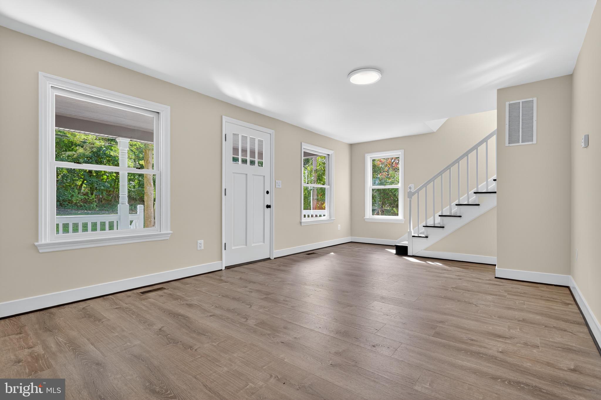 10612 Honeyfield Road Williamsport, MD 21795 - Photo 3 of 19 a view of an empty room with wooden floor and a window