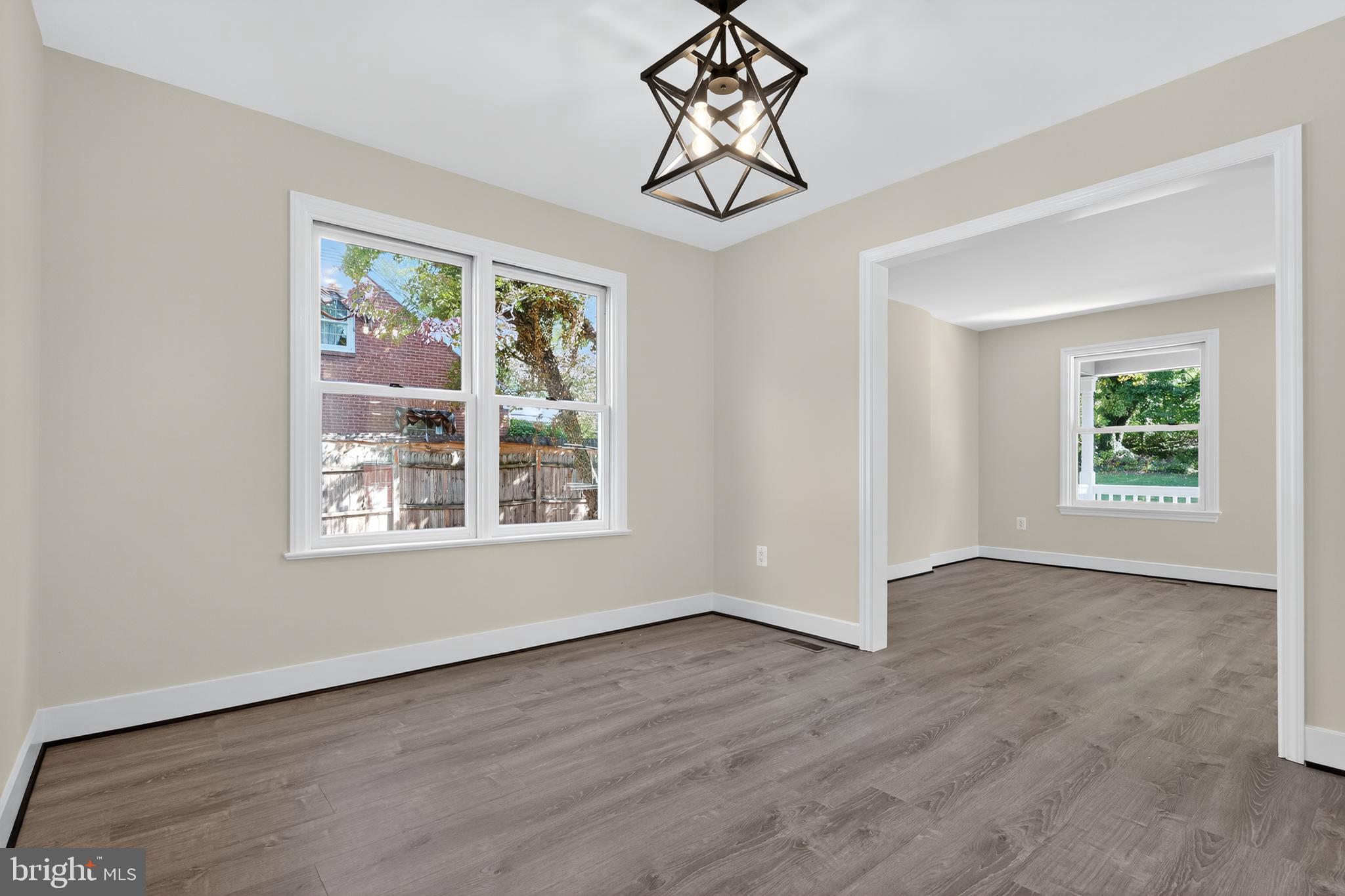 10612 Honeyfield Road Williamsport, MD 21795 - Photo 10 of 19 a view of an empty room with wooden floor and window