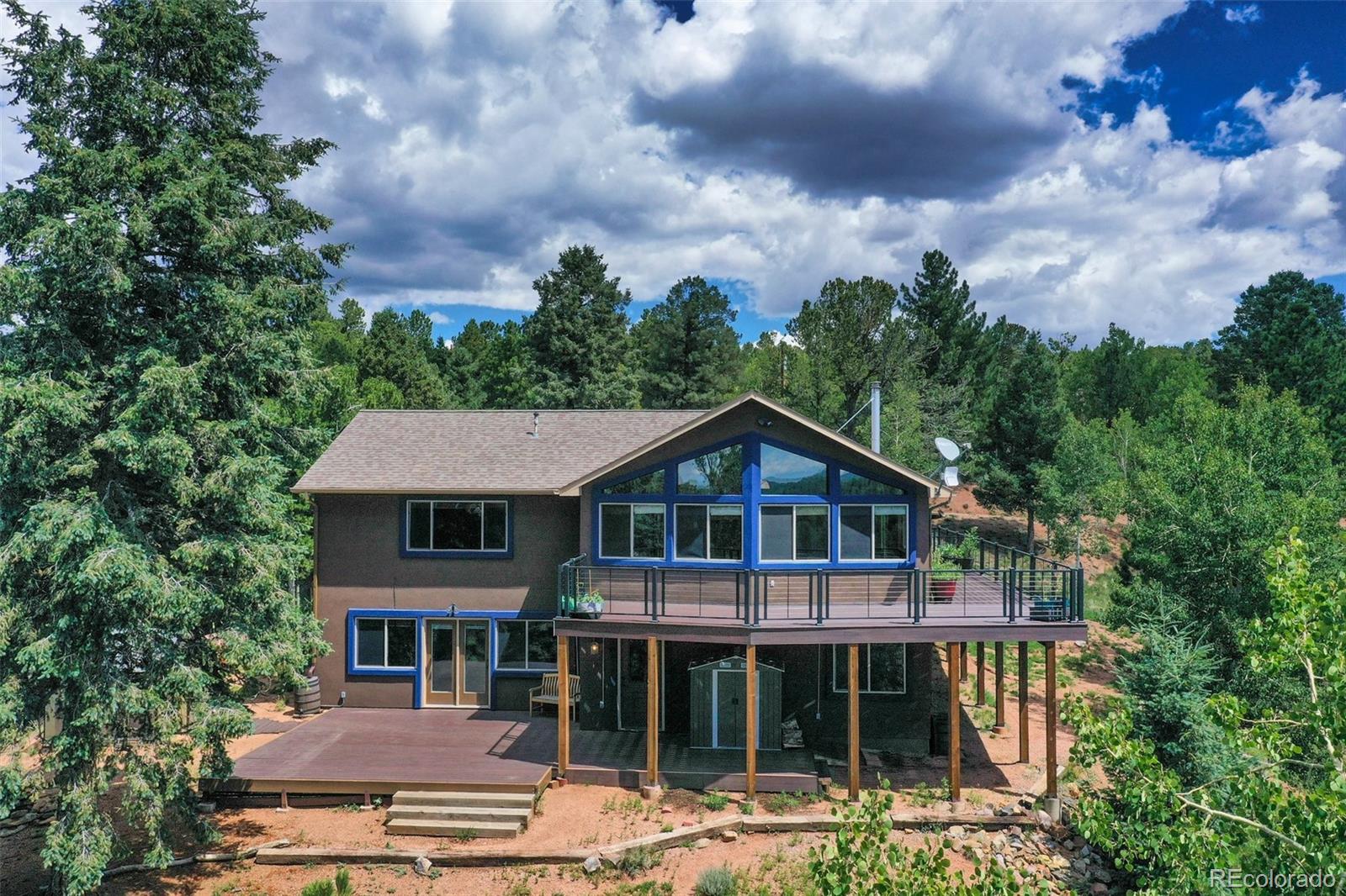 85 Homestead Road Divide, CO 80814 - Photo 14 of 50 a front view of a house with garden