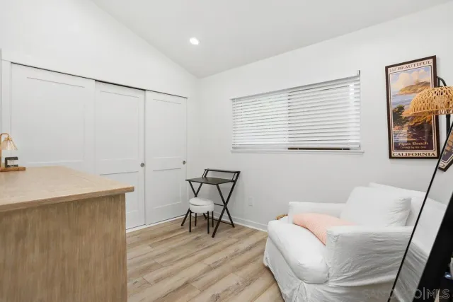 a work room with furniture and a window