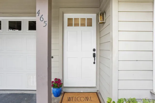 a view of door and living room