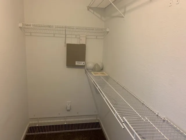 a view of a room with racks on the wall