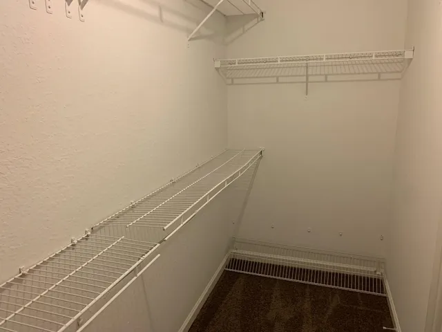 a view of a room with racks on the wall