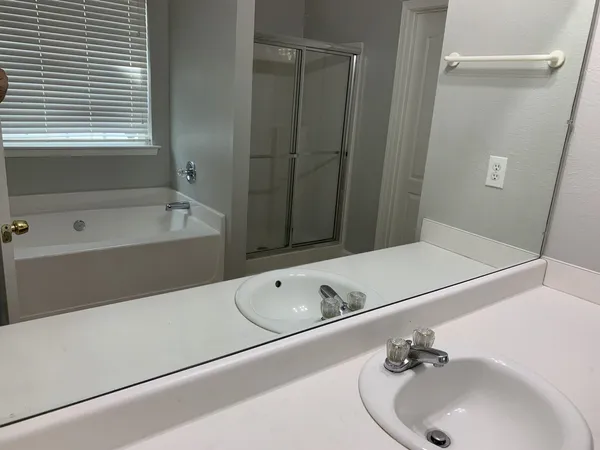 a bathroom with a tub and a sink