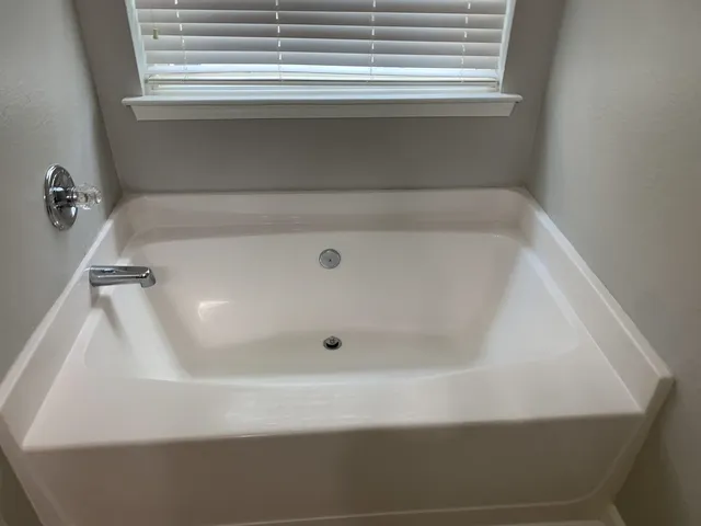 a close up of a bathtub in a bathroom