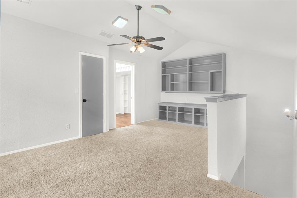 3048 Airhaven Street Dallas, TX 75229 - Photo 12 of 14 a view of a livingroom with a ceiling fan window and wooden floor