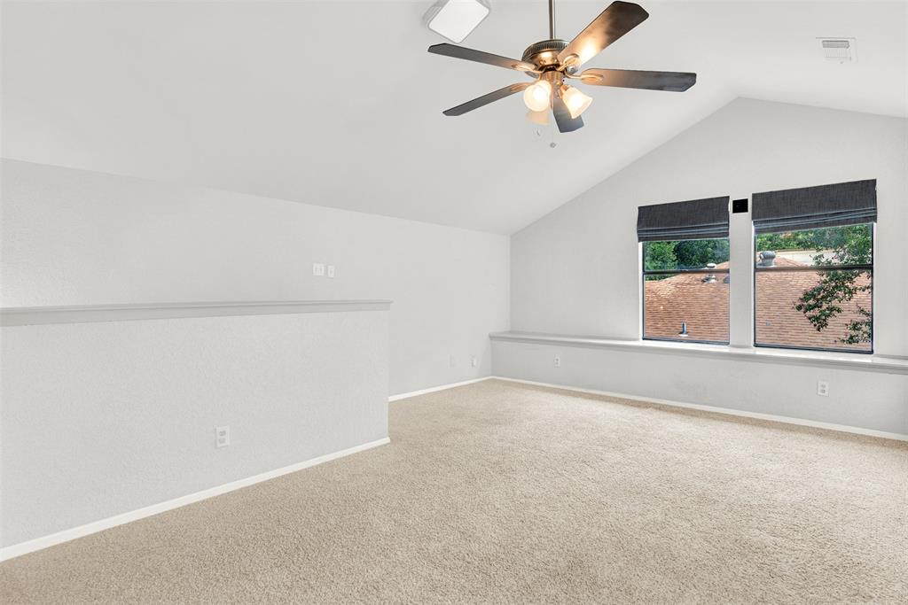 3048 Airhaven Street Dallas, TX 75229 - Photo 13 of 14 an empty room with a window and a ceiling fan