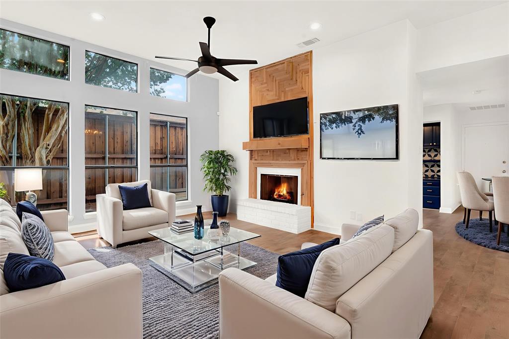 3048 Airhaven Street Dallas, TX 75229 - Photo 4 of 14 a living room with furniture a fireplace and a flat screen tv