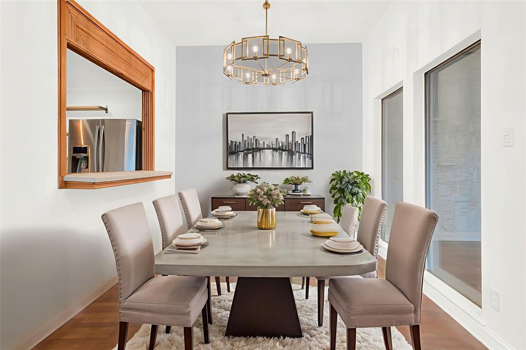 3048 Airhaven Street Dallas, TX 75229 - Photo 5 of 14 a view of a dining room with furniture wooden floor and a chandelier