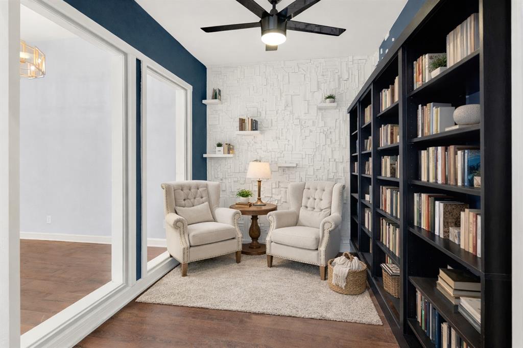 3048 Airhaven Street Dallas, TX 75229 - Photo 6 of 14 a living room with furniture and a book shelf