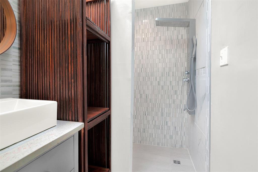 3048 Airhaven Street Dallas, TX 75229 - Photo 9 of 14 a bathroom with a bathtub and a shower