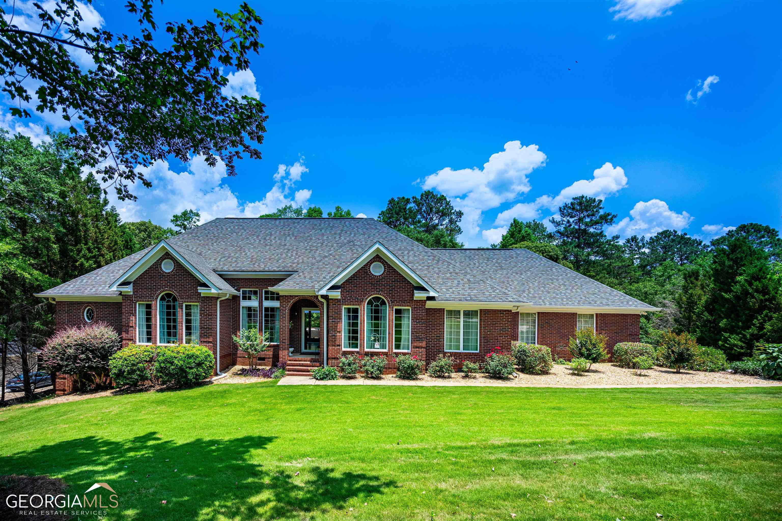124 Sunny Point Circle LaGrange, GA 30240 - Photo 1 of 1 a front view of a house with garden