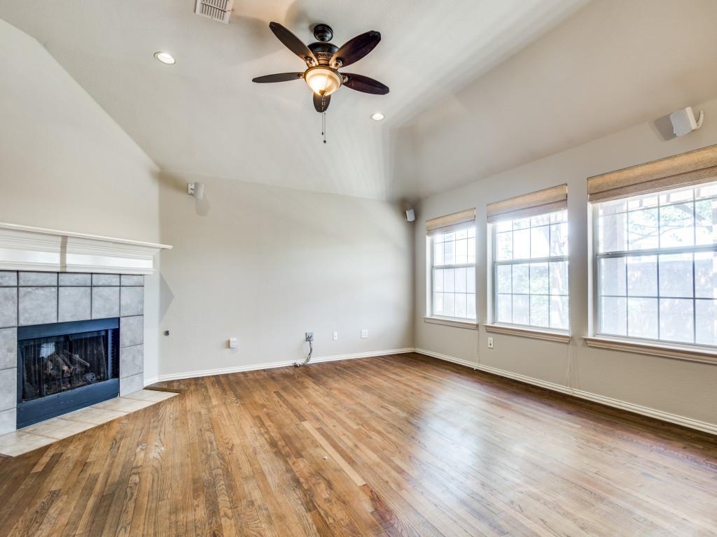 5924 Legend Lane The Colony, TX 75056 - Photo 12 of 27 a view of an empty room with a fireplace and a window