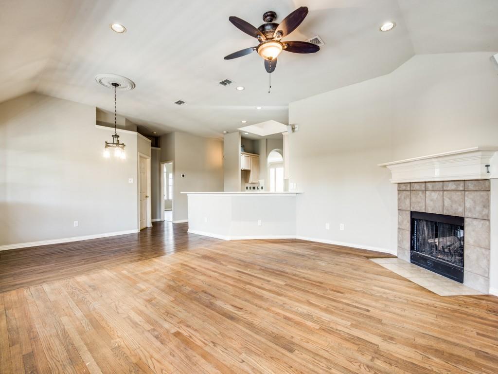 5924 Legend Lane The Colony, TX 75056 - Photo 14 of 27 a view of a room a ceiling fan and fireplace