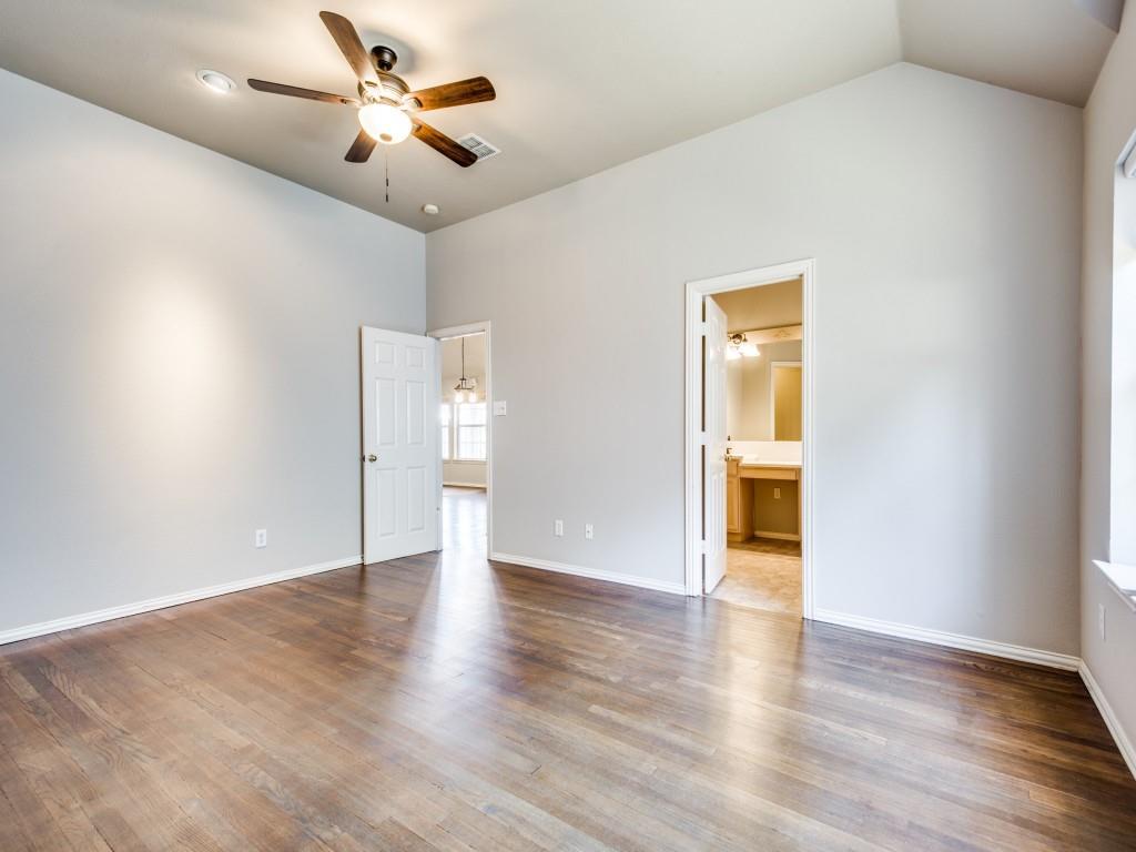 5924 Legend Lane The Colony, TX 75056 - Photo 15 of 27 a view of an empty room with wooden floor and a ceiling fan