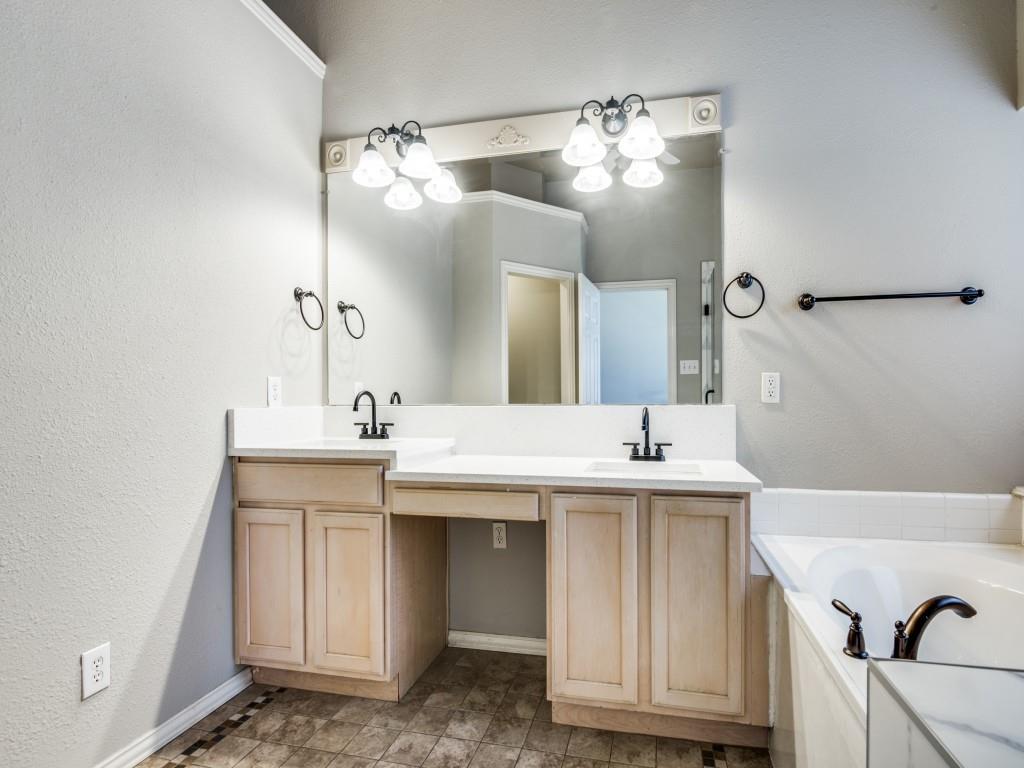 5924 Legend Lane The Colony, TX 75056 - Photo 16 of 27 a bathroom with a sink and a mirror