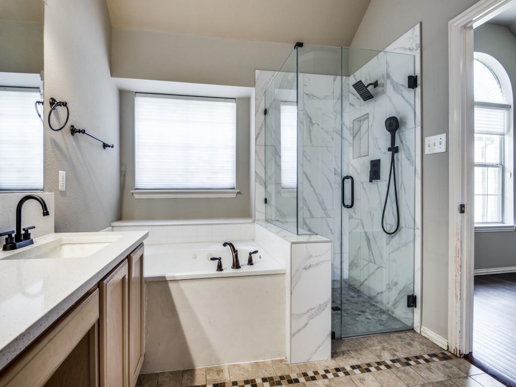 5924 Legend Lane The Colony, TX 75056 - Photo 17 of 27 a bathroom with a granite countertop sink a mirror and a shower