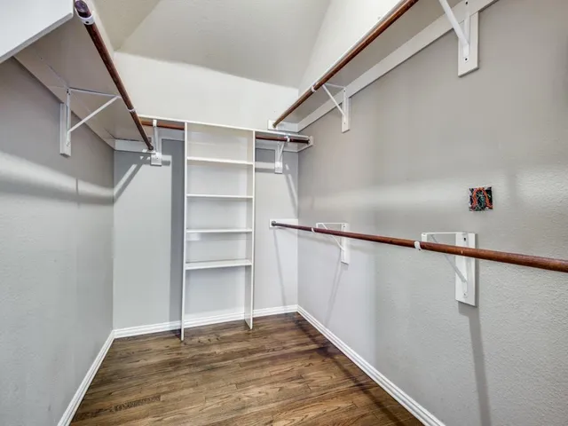 a view of an empty walk in closet
