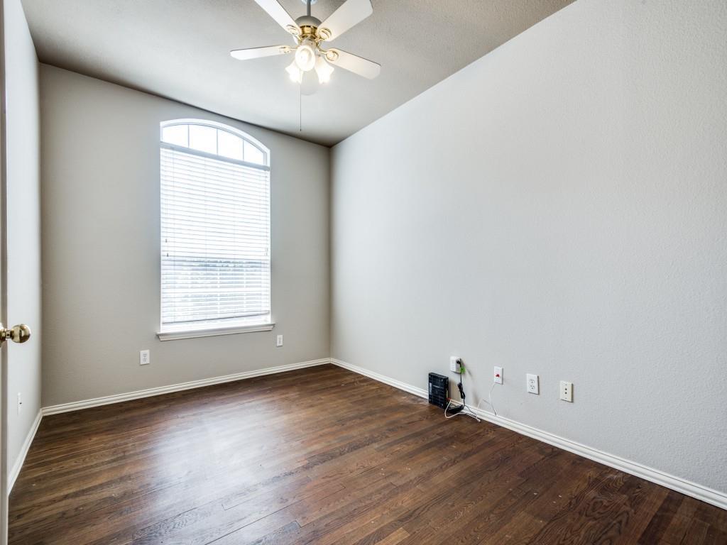5924 Legend Lane The Colony, TX 75056 - Photo 22 of 27 an empty room with wooden floor and windows