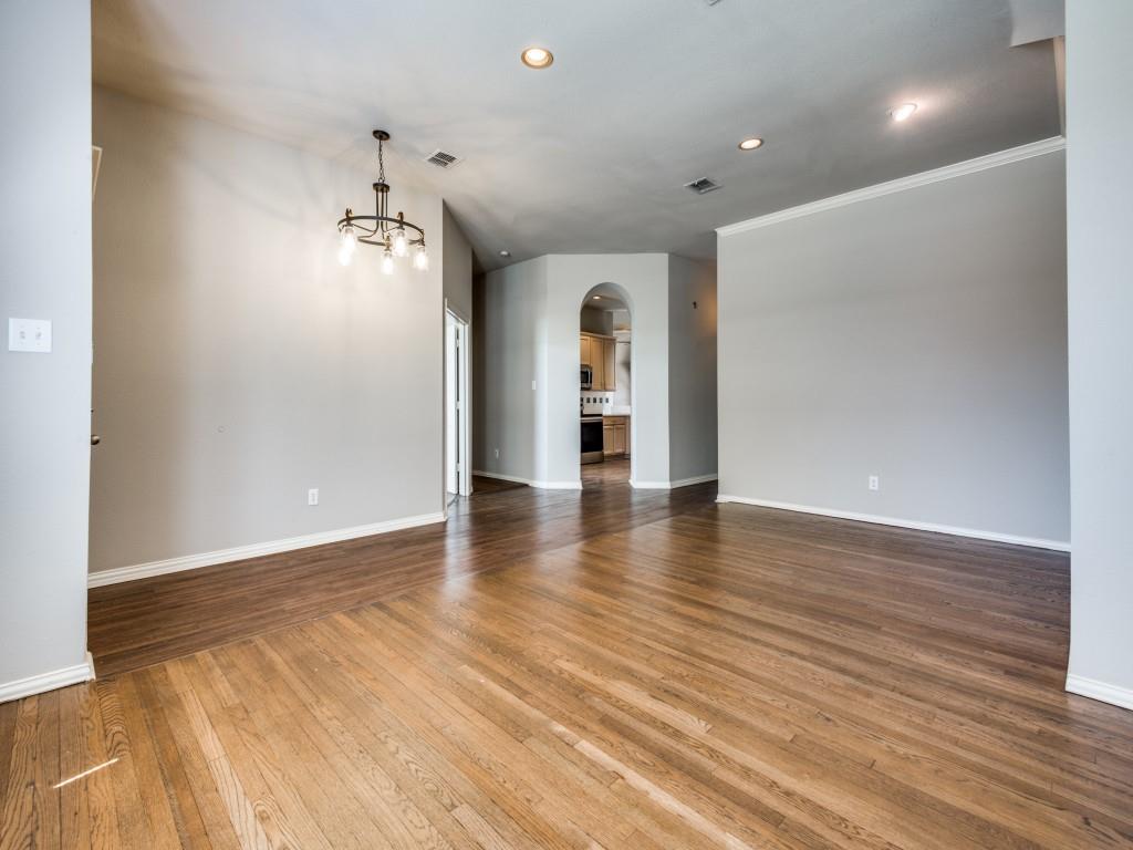 5924 Legend Lane The Colony, TX 75056 - Photo 4 of 27 wooden floor in an empty room with a window