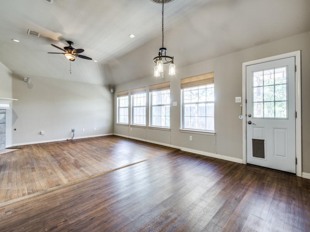 5924 Legend Lane The Colony, TX 75056 - Photo 9 of 27 an empty room with wooden floor and windows
