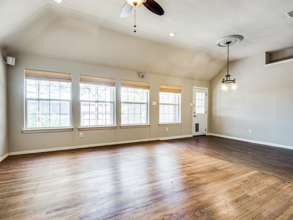 5924 Legend Lane The Colony, TX 75056 - Photo 10 of 27 an empty room with wooden floor and windows